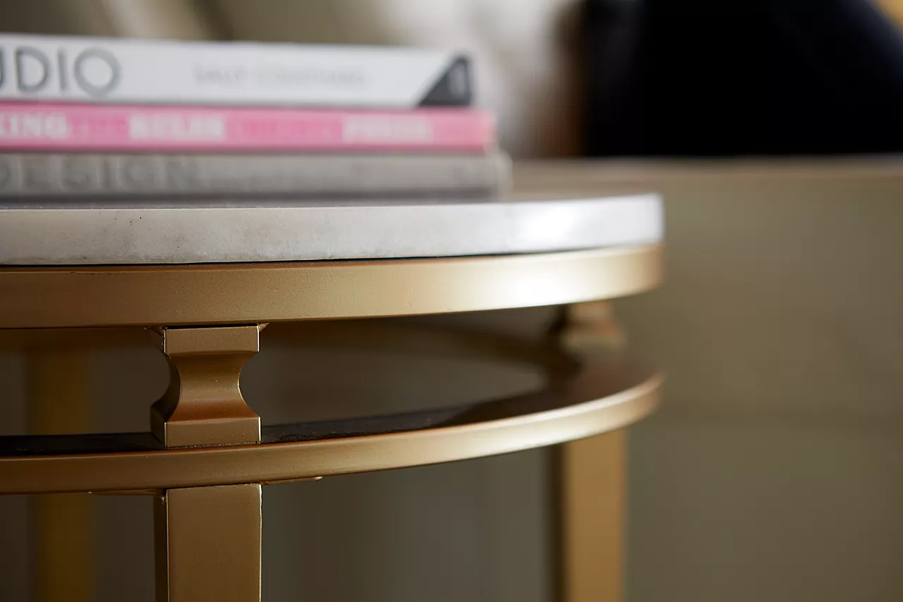 The Amani marble and gold finish chairside table in room scene.
